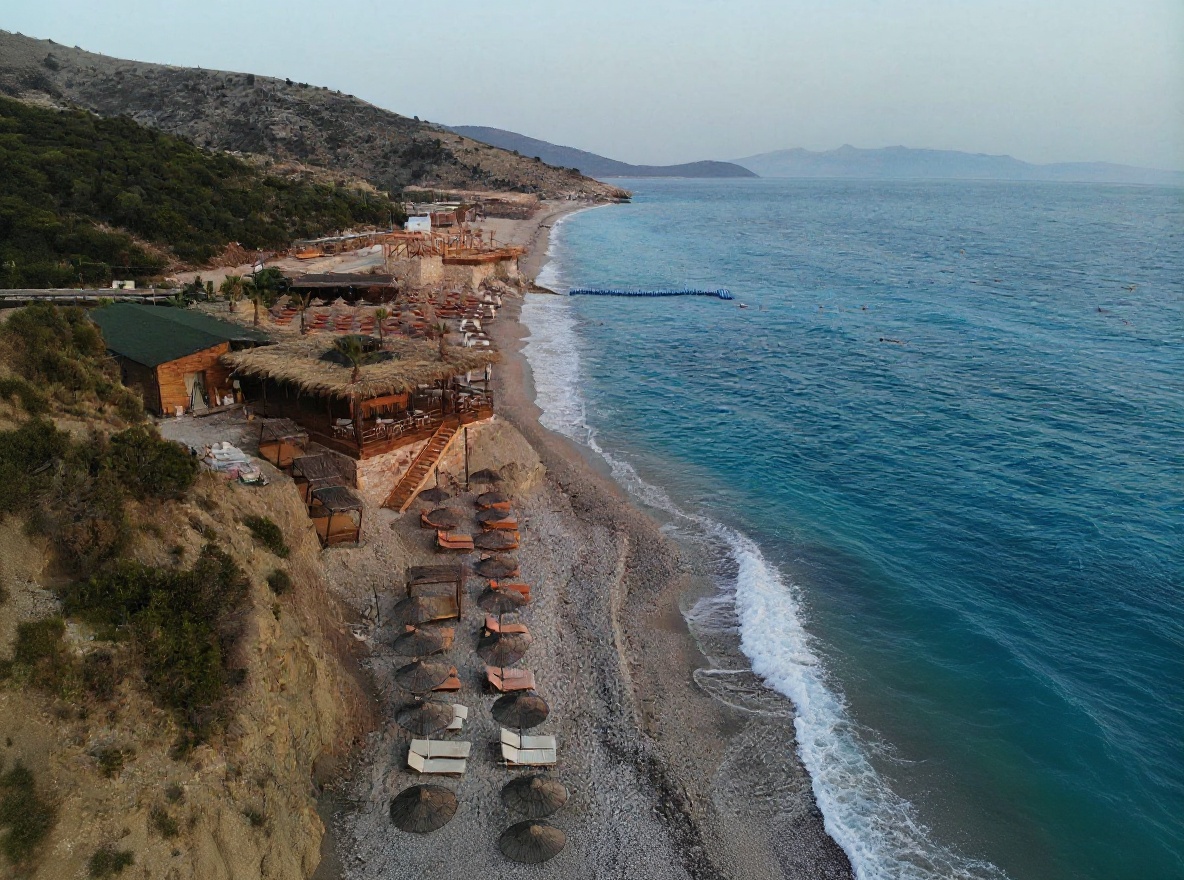 Dhërmiu Bay — popular for good reason, best visited early morning before the crowds arrive